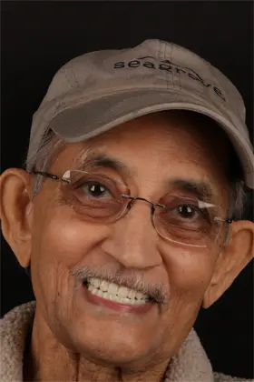 Patient's glowing smile following cosmetic gum contouring and dental veneers.